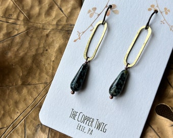 Earrings - Hammered brass ovals, black/grey tear drop shape glass beads, niobium wire, lead & nickel free, hypoallergenic, Erie Pa