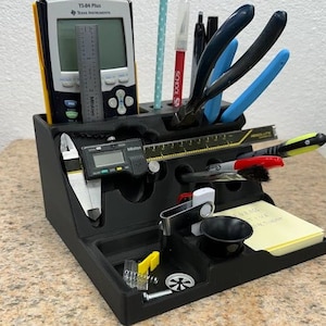 3D printed desk organizer with compartments for tools and supplies.