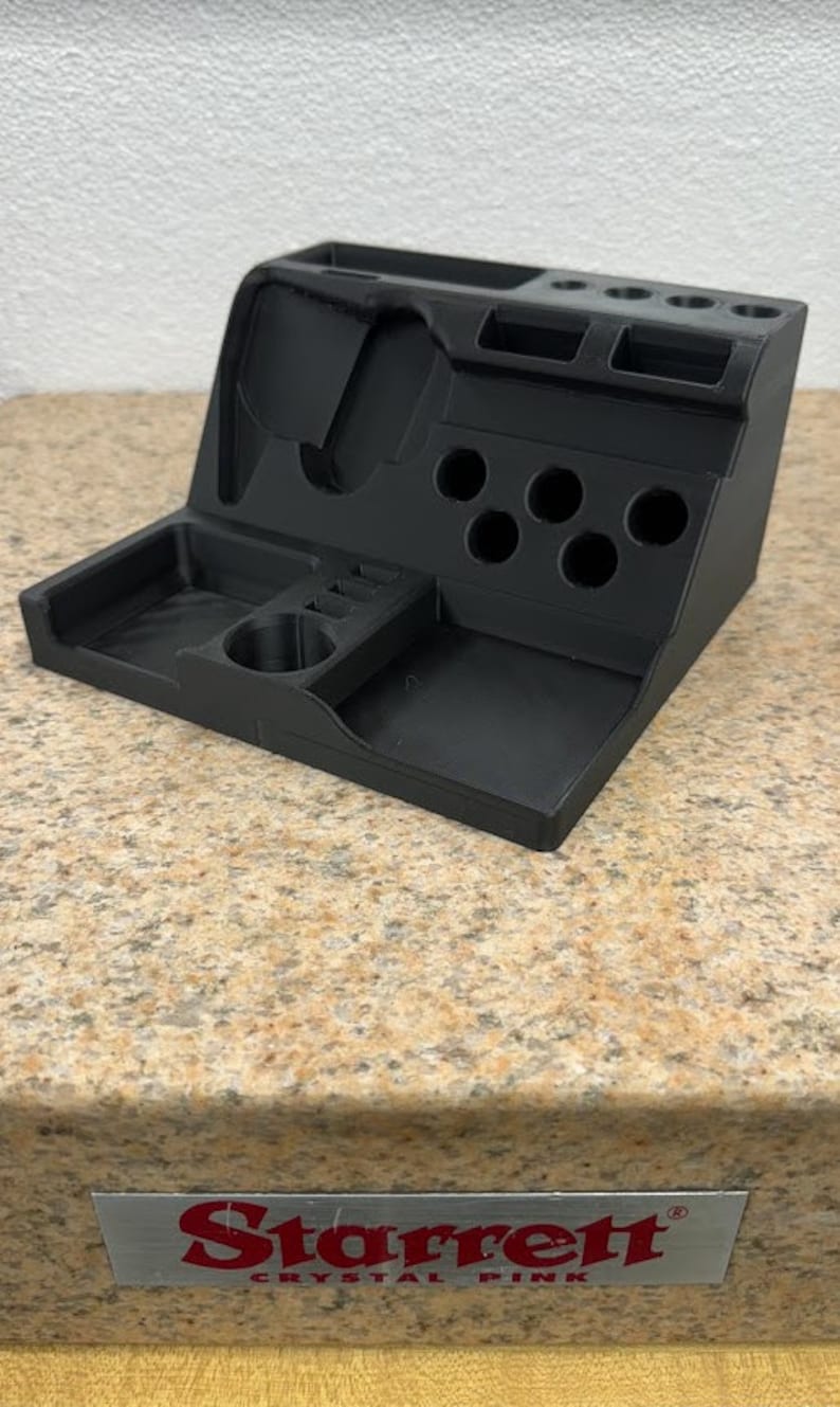 3D printed desk organizer with compartments for tools and supplies.