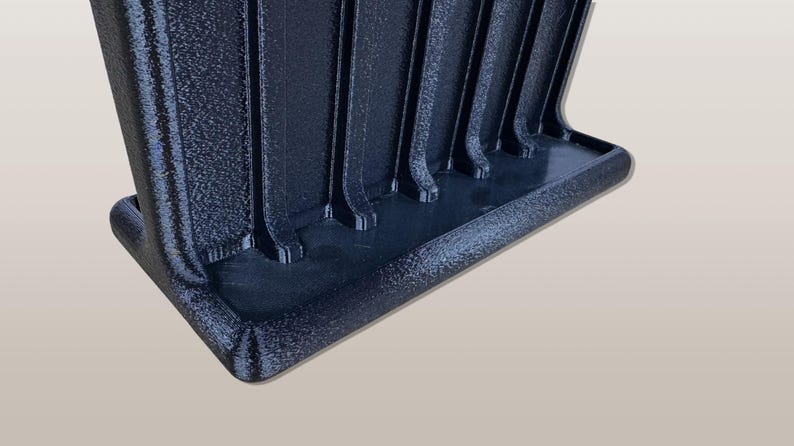 3D printed tool organizer with 16 slots, including extra-wide ones, for screwdrivers, pliers, wrenches, and more. Keeps tools organized and easily accessible.