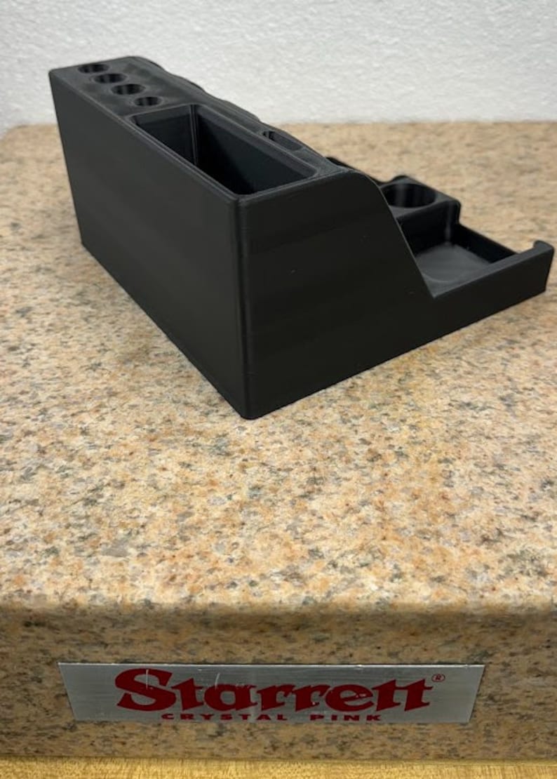 3D printed desk organizer with compartments for tools and supplies.