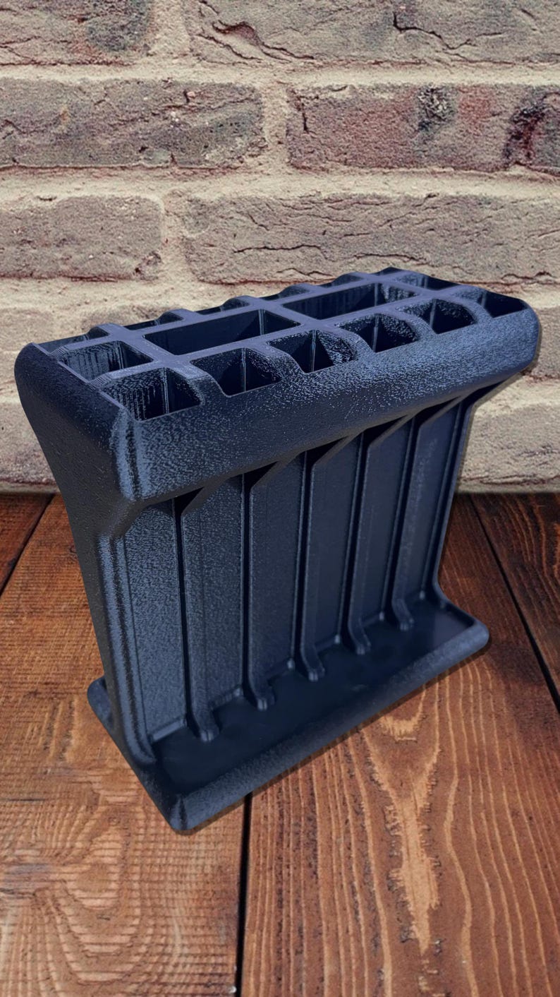 3D printed tool organizer with 16 slots, including extra-wide ones, for screwdrivers, pliers, wrenches, and more. Keeps tools organized and easily accessible.