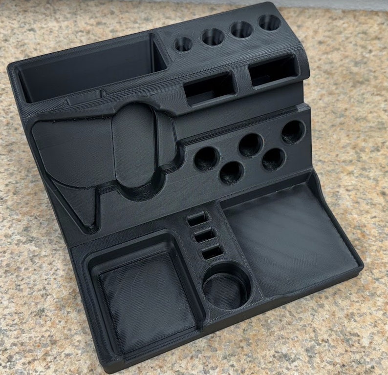 3D printed desk organizer with compartments for tools and supplies.