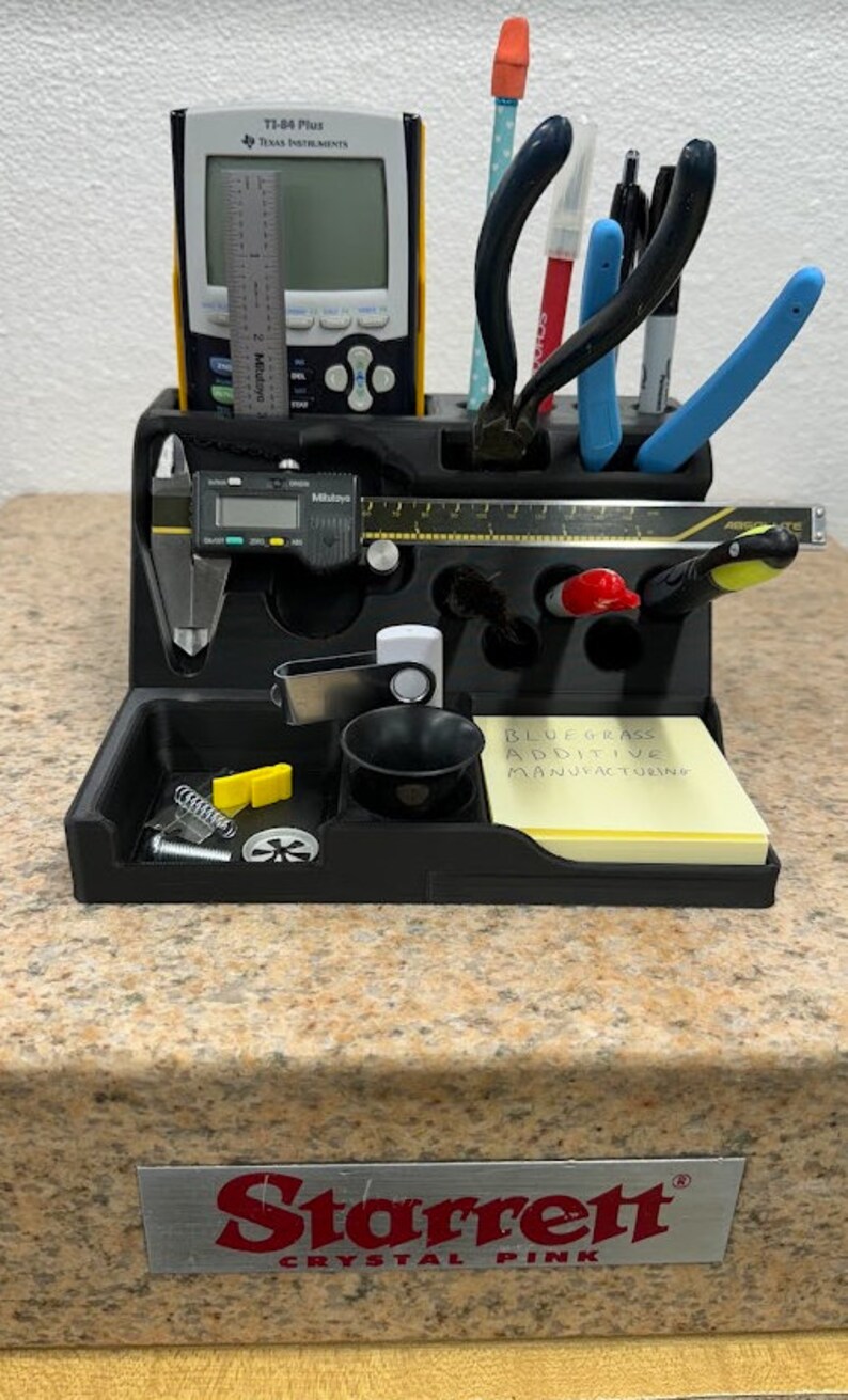 3D printed desk organizer with compartments for tools and supplies.