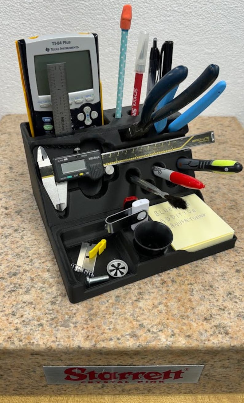 3D printed desk organizer with compartments for tools and supplies.