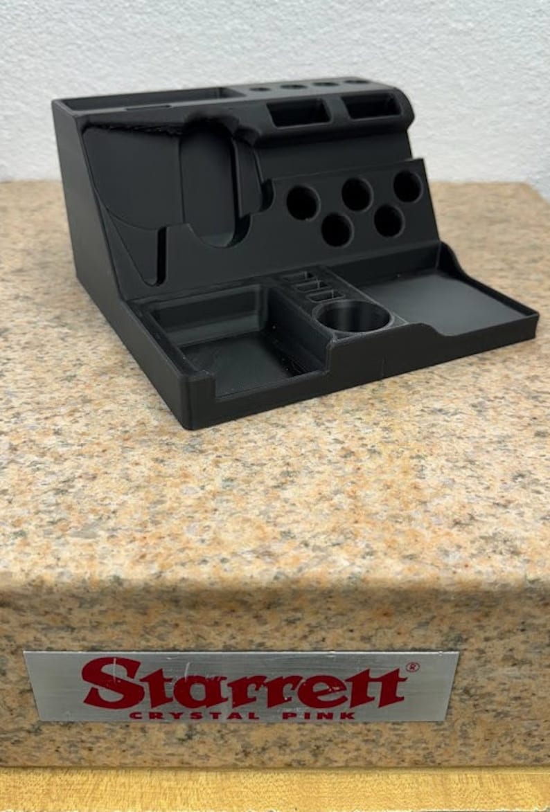 3D printed desk organizer with compartments for tools and supplies.