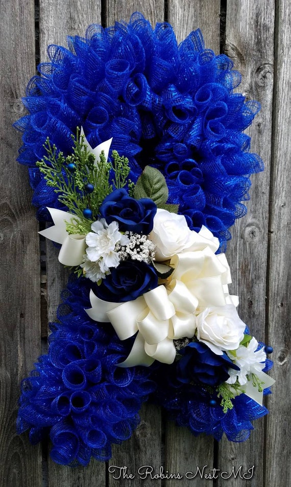 Blue & White Funeral Flower Wreath by Everyday Flowers