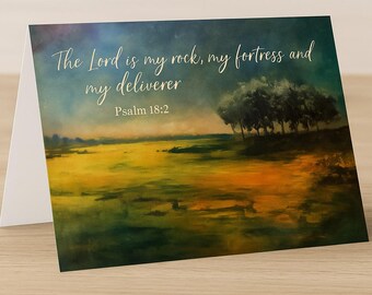 May include: A watercolor painting of a landscape with a quote from the Bible, "The Lord is my rock, my fortress and my deliverer, Psalm 18:2". The painting features a field of green grass with a row of trees in the background.