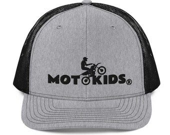 May include: A gray and black trucker hat with a black embroidered logo that says "MOTO KIDS" and a silhouette of a person riding a dirt bike.