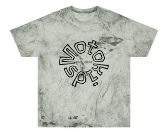 May include: A light green and gray tie-dye t-shirt with a black graphic. The graphic reads "NOTO SPORTS" in a circular design, with "est. 2014" in the center. The shirt has a crew neck and short sleeves.