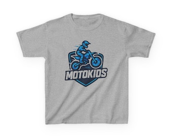 May include: A light gray t-shirt featuring a blue graphic of a person riding a motorcycle. The graphic is inside a blue shield with the word "MOTOKIDS" in white text below the motorcycle illustration.