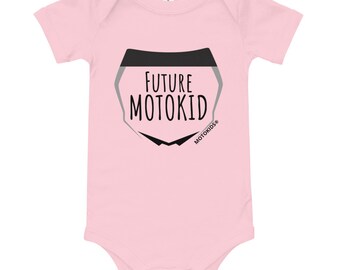 May include: Pink baby onesie with a black and gray graphic of a motorcycle helmet with the text "FUTURE MOTOKID" and the logo "MOTOKIDS®" underneath.