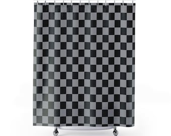 May include: A black and gray checkered shower curtain. The curtain is hanging from a metal rod with silver rings. The pattern is a repeating grid of black and gray squares, creating a bold, graphic design. The curtain is made of a fabric material.