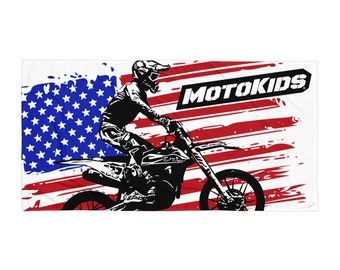 May include: A black and white illustration of a motocross rider on a dirt bike, with an American flag background and the text "MOTOKIDS".