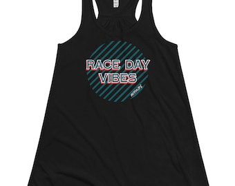 May include: Black racerback tank top with a teal and white striped circle graphic. The graphic has the text "RACE DAY VIBES" in red and white letters and the text "MOTORKIDS" in white letters.
