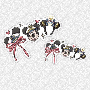 May include: Two sticker sheets featuring Mickey Mouse in sailor attire and themed headbands. The stickers include Mickey's face, sailor hats, pink bows, and anchor details. The designs are in black, white, blue, and pink.