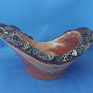 Hand turned natural edge winged cherry bowl