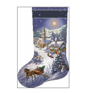 May include: A Christmas stocking featuring a winter village scene. The stocking is blue with white snowflakes and depicts a church, houses, and a horse-drawn sleigh in the snow.