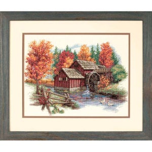 May include: A red wooden watermill with a water wheel sits beside a stream in a forest. The trees have vibrant fall foliage in shades of red, orange, and yellow. Two white ducks swim in the stream.