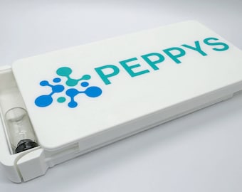 The Peppys Box - a minimalist, modern, Cisca peptide box.  Slide top hingeless squeeze to open.  Holds 10-20 vials with Peppys cool logo.