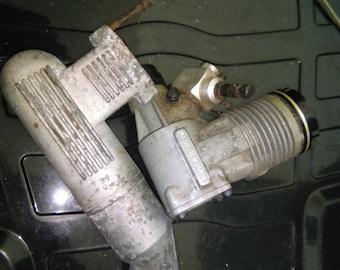 Vintage 1980s-1990s nitro model aircraft airplane aeroplane engines X 2 and one exghaust pipe - spares or repair for a hobbyist