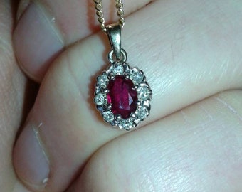 Earth mined oval cut low heat only ruby 6mmx5mm,  natural round cut diamond 9ct gold pendant on 9ct curb trace chain