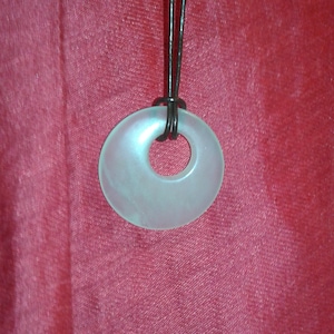 Celadon Nephrite Jade Bi disc Bronze Age symbol on brown leather cord minimalist Organic jewellery