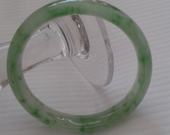 Untreated (A) Jadeite jade watery glutinous translucent floating flower Piao Hua 飘花 gemstone material 56mm womens Chinese Oriental bangle