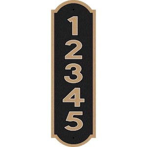 May include: A vertical black and gold house number plaque with the numbers 1, 2, 3, 4, and 5.