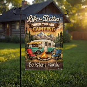 May include: A rectangular garden flag featuring a camping scene with a teal and white vintage camper, a campfire, and two folding chairs. The text reads Life is Better WHEN YOU ARE CAMPING and Goulstone Family, set against a mountain backdrop.