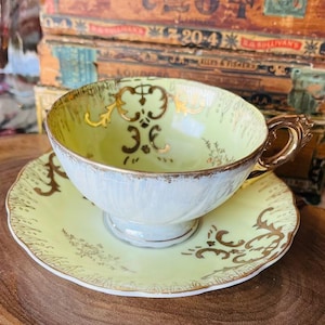 Sweet yellow and gold teacup and saucer