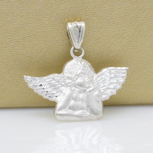 May include: Silver angel pendant charm with detailed wings and a textured finish. The angel is sitting with its head resting on its hand.