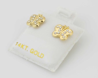 Puede incluir: Un par de pendientes de mariposa de oro con detalles de cristal transparente. Los pendientes se muestran en una tarjeta blanca con el texto "14KT. GOLD".