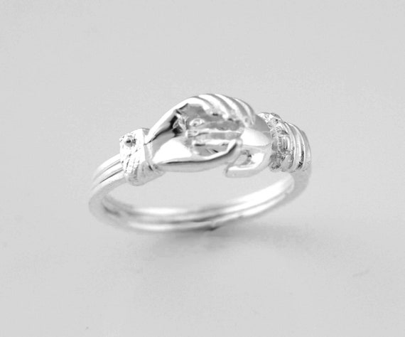 Anillo manos entrelazadas hotsell