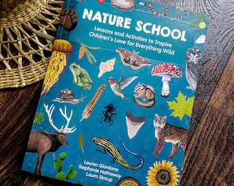May include: A hardcover book titled "NATURE SCHOOL" with a teal cover featuring illustrations of various animals and plants. The book's title is in large white letters, and the cover includes the names of the authors: Lauren Giordano, Stephanie Hathaway, and Laura Stroup.