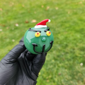 Green Holiday Grump Pipe – Handblown Glass Spoon with Angry Face – Anti-Christmas Vibes – Funny Holiday Smoking Gift – Misfit Character Pipe