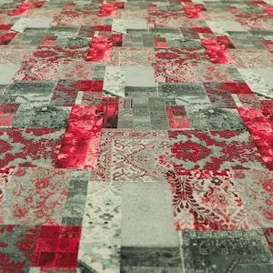 May include: A patchwork rug featuring a red, white and grey colour scheme. The rug has a variety of patterns, including floral and geometric designs.
