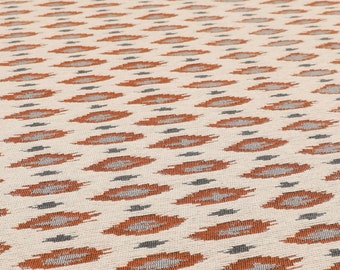 May include: A white fabric with a repeating pattern of orange and grey teardrop shapes.