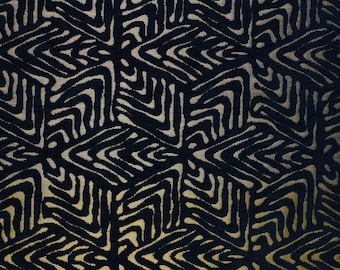 May include: Abstract geometric pattern fabric in black and gold. The pattern is made up of repeating shapes that create a sense of movement and depth.