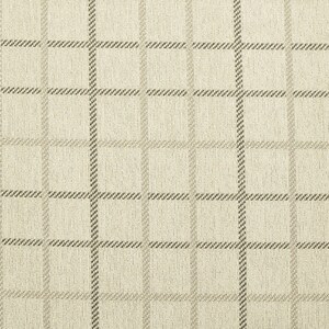 May include: A beige fabric with a brown and white checkered pattern.