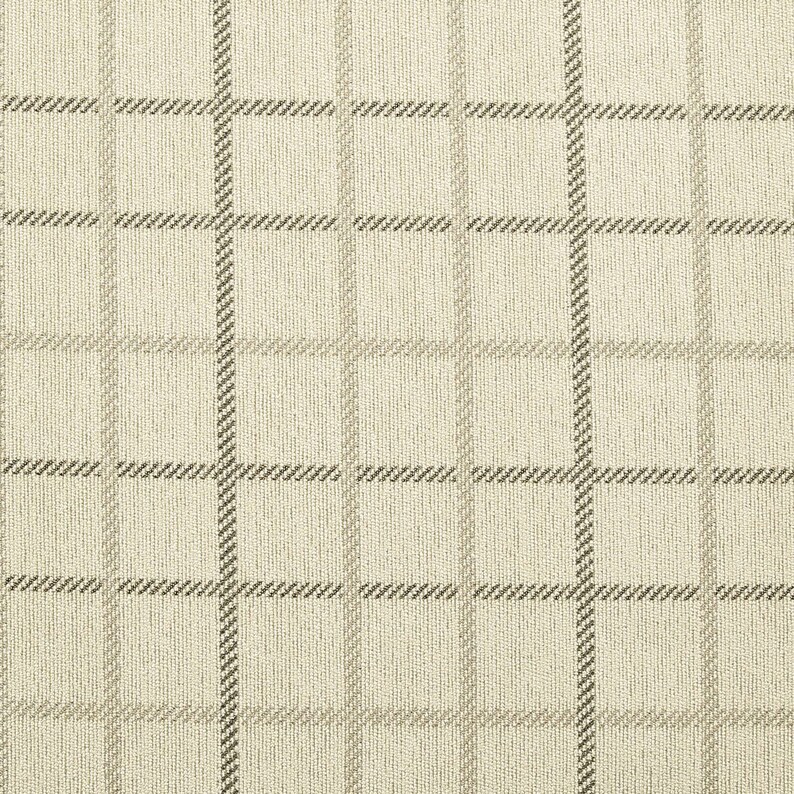 May include: A beige fabric with a brown and white checkered pattern.