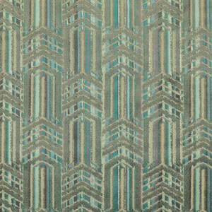 May include: Teal, green, and beige patterned fabric with a geometric design. The fabric has a textured, woven look.