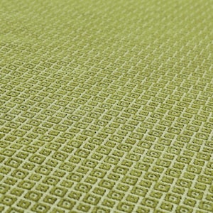 May include: Close-up of a textured, light green fabric with a repeating diamond pattern. The fabric has a woven appearance, with a subtle variation in the shade of green, creating depth and visual interest. The overall texture is soft and inviting.