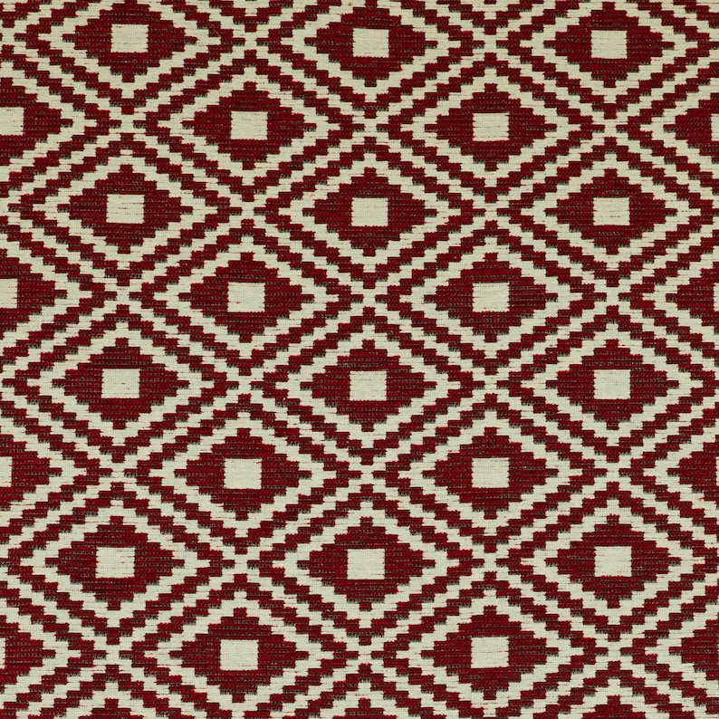 May include: Red and white geometric patterned fabric with a diamond design.