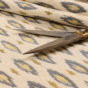 Ikat Inspired Small Motif Design Pattern In Grey Colour Soft Woven Jacquard Upholstery Fabric Perfect For Home Textile