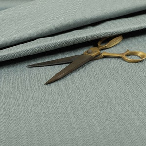 Herringbone Pattern Semi Plain Medium Weight Upholstery Fabric In Silver Colour