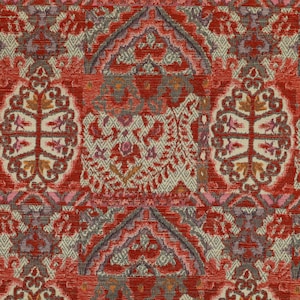 May include: Close-up of a patterned fabric with a repeating design. The fabric has a vibrant red background with intricate patterns in beige, brown, and purple. The design includes geometric shapes and floral motifs, creating a textured appearance.