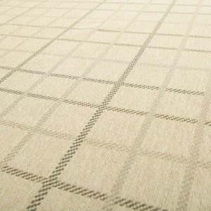 May include: A close-up of a beige fabric with a subtle, woven, geometric pattern. The fabric has a slightly textured surface.