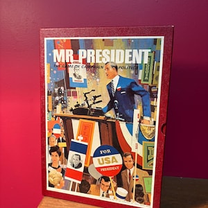 May include: A vintage board game box titled "MR PRESIDENT" with a red border. The box art depicts a man in a blue suit speaking at a podium, with campaign signs and a crowd in the background. The words "THE GAME OF CAMPAIGN POLITICS" are also visible.