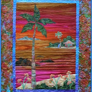 May include: A quilted wall hanging with a tropical sunset scene. The scene features a palm tree, a small house, and a beach with flowers. The background is a gradient of orange, pink, and purple.